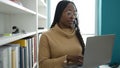 African woman using laptop at library university Royalty Free Stock Photo