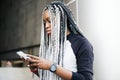 African woman using smartphone outdoors