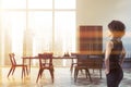 African woman in white dining room Royalty Free Stock Photo