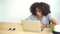 African woman working with laptop from home serious entrepreneur mindset Royalty Free Stock Photo
