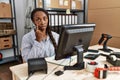 African woman working at small business ecommerce pointing to the eye watching you gesture, suspicious expression Royalty Free Stock Photo