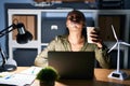 African woman working using computer laptop at night puffing cheeks with funny face Royalty Free Stock Photo