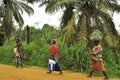 African women carrying food and wood