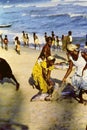 African women collecting fresh fish on a beach near Accra, Ghana, c.1959