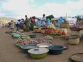 African women selling food on a dusty roadside