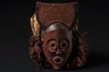 African wooden mask with hair, isolated