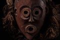African wooden mask with hair, isolated