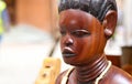 African Wooden Woman Sculpture on Antique Market Royalty Free Stock Photo