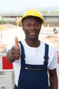 African worker at construction zone showing thumb up Royalty Free Stock Photo