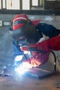 African worker welder with red gloves