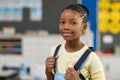 Girl wearing backpack at school Royalty Free Stock Photo