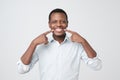 African young handsome man showing his excellent white teeth. Royalty Free Stock Photo