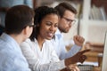 African young intern or mixed-race new employee talking to mentor Royalty Free Stock Photo