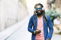 African Young Man Listening Music. Royalty Free Stock Photo