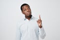 African young man showing index fingers up, giving advice Royalty Free Stock Photo