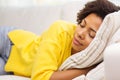 African young woman sleeping on sofa at home Royalty Free Stock Photo