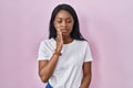 African young woman wearing casual white t shirt touching mouth with hand with painful expression because of toothache or dental Royalty Free Stock Photo