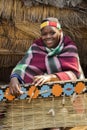 African Zulu woman weaves straw carpet. Royalty Free Stock Photo