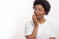 Africanamerican woman trying to close her mouth while sneezing Royalty Free Stock Photo