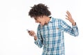 Afro amerian man screaming on smartphone Royalty Free Stock Photo