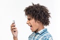 Afro amerian man screaming on smartphone Royalty Free Stock Photo