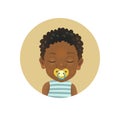 Afro American African sleeping child with soother pacifier. Dark-skinned toddler sleep with dummy facial expression