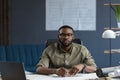 Afro-American architect working in office with laptop.Business portrait of black handsome bearded man wearing eyeglasses Royalty Free Stock Photo