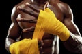 Afro American boxer is wrapping hands with bandage