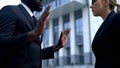 Afro-american businessman apologizing to female boss for poor quality work