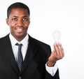 Afro-American businessman holding a light bulb Royalty Free Stock Photo