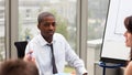 Afro-American businessman interacting with his tea Royalty Free Stock Photo