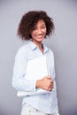 Afro american businesswoman standing with folder Royalty Free Stock Photo