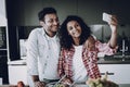 Afro American Couple Doing Selfie At Kitchen. Royalty Free Stock Photo