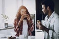 Afro American Couple Has A Breakfast At Kitchen. Royalty Free Stock Photo