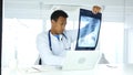 Afro-American Doctor Examing X-ray of Patient, Lungs and Ribcage Royalty Free Stock Photo