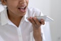 Afro american girl talking on speakerphone with friends Royalty Free Stock Photo