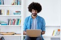 Afro american hipster man in quarantine at computer Royalty Free Stock Photo