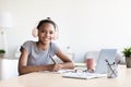 Afro american kid studying using computer, preschool child at home school Royalty Free Stock Photo