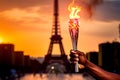 Afro american male athlete holding Olympic torch with burning flame in hand on eiffel tower background Royalty Free Stock Photo