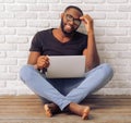 Afro American man with gadget Royalty Free Stock Photo