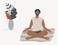 Afro-american man sitting with his legs crossed on floor and meditating. Young guy in yoga posture doing meditation, mindfulness