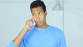 Afro-American Man Talking on Smartphone in Office Royalty Free Stock Photo