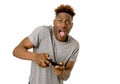 Afro american man using remote controller playing video game ha Royalty Free Stock Photo