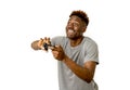 Afro american man using remote controller playing video game ha Royalty Free Stock Photo
