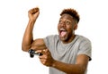 Afro american man using remote controller playing video game ha Royalty Free Stock Photo