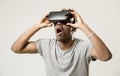 Afro american man wearing virtual reality vr 360 vision goggles enjoying video game Royalty Free Stock Photo