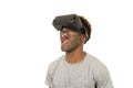 Afro american man wearing virtual reality vr 360 vision goggles enjoying video game Royalty Free Stock Photo