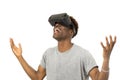 Afro american man wearing virtual reality vr 360 vision goggles enjoying video game Royalty Free Stock Photo