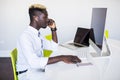 Afro american man working in call center. Manager with computer. Man on workplace. Consultant with microphone. Customer service Royalty Free Stock Photo