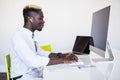 Afro american man working in call center. Manager with computer. Man on workplace. Consultant with microphone. Customer service Royalty Free Stock Photo